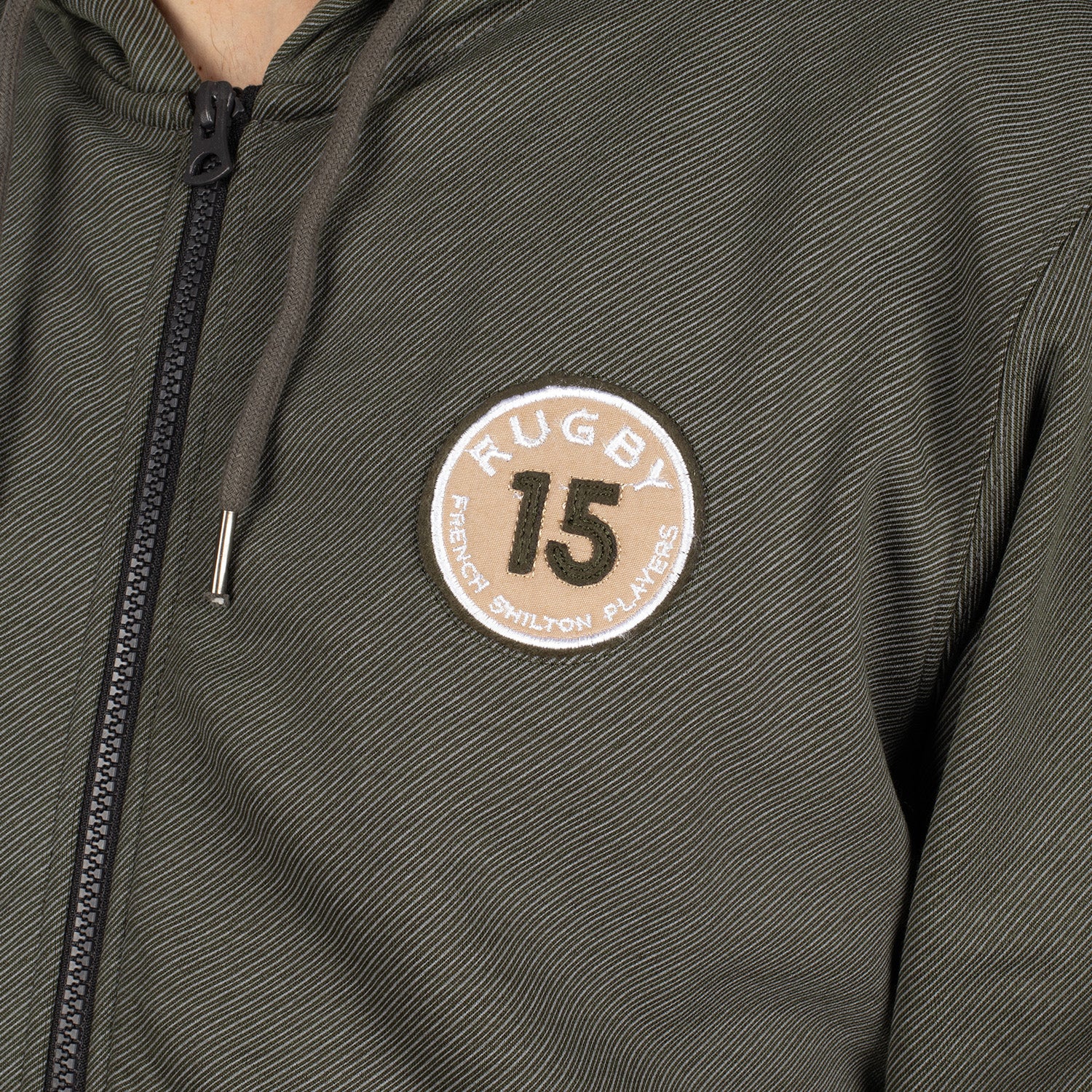 Hooded vest with crest